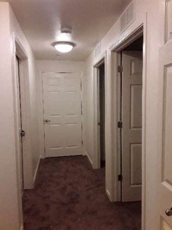 Image of hallway with light and doors - Photo Gallery 9