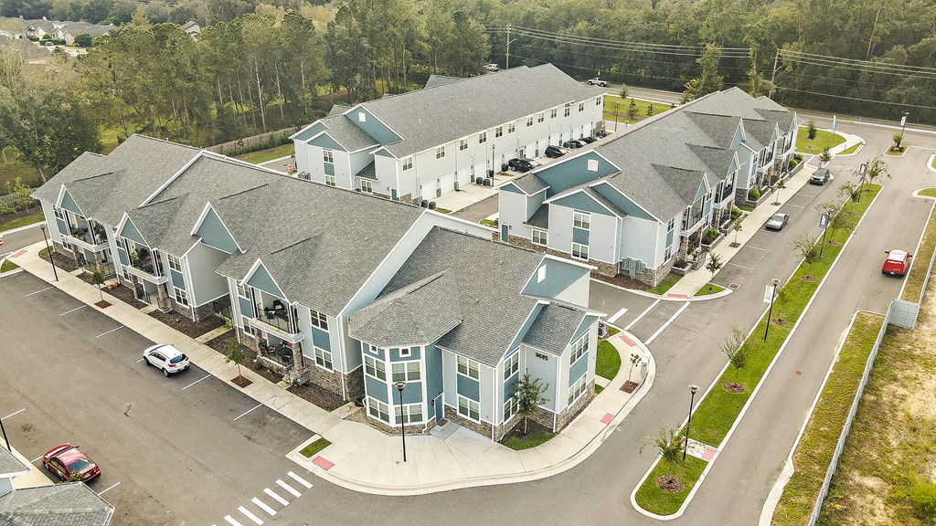 an aerial view of a row of houses on a street