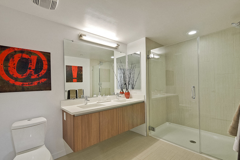 Apartments in Campbell-Revere Campbell Bathroom with Double Sink and Large Glass Shower