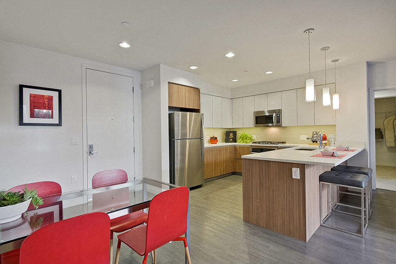 Apartments for Rent in Campbell, CA - Revere Campbell - Kitchen with Spacious Quartz Counters, Hanging Light Fixtures, and Stainless-Steel Appliances
