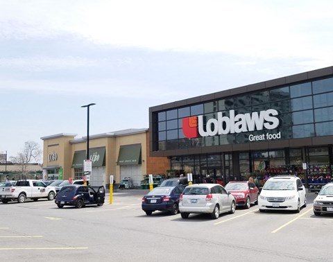 a colabans store with cars parked in a parking lot
