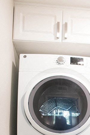 PearlHomeFinishes-Full-size washer and dryer in home Pearl Home washer and dryer at Merrick apartments in Placentia CA