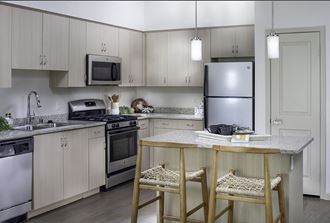 Grey kitchen at Pulse Millenia apartments in Chula Vista CA