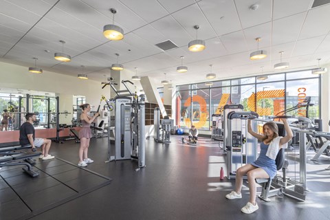 a group of people working out in a gym