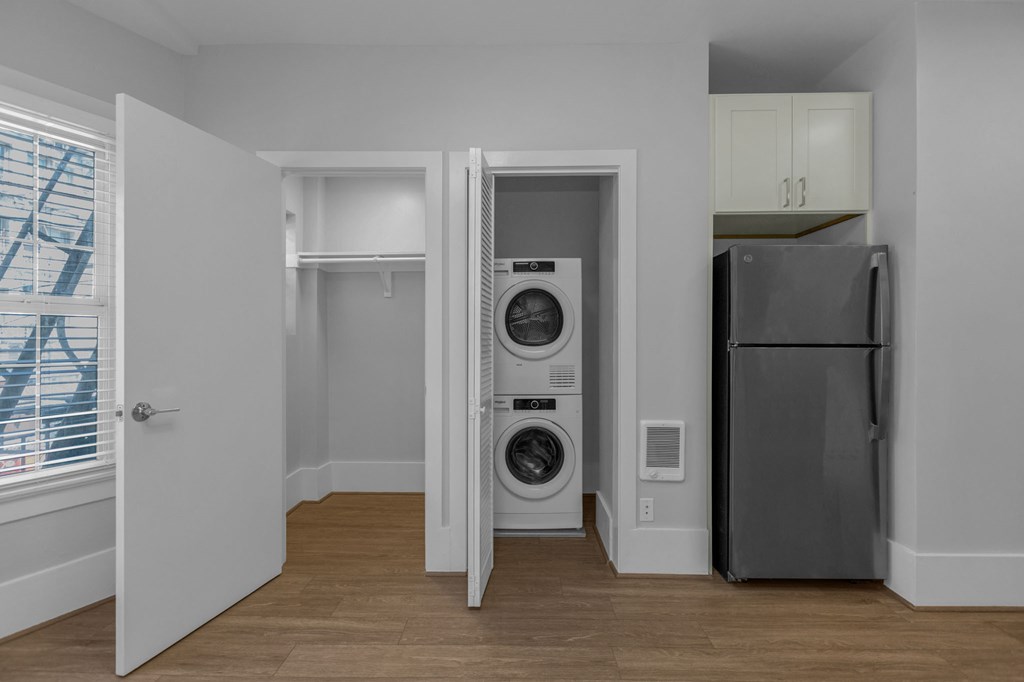 a small laundry room with a washer and dryer in a closet