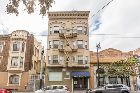 A street view of a building with the number 1025 on it.