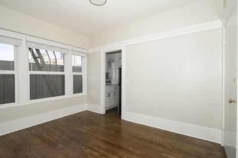 A room with wooden floors and white walls.
