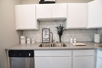 White Cabinets in the Model Kitchen at CORE Apartments Ames IA White Cabinets in the Model Kitchen at CORE Apartments Ames IA - Photo Gallery 4