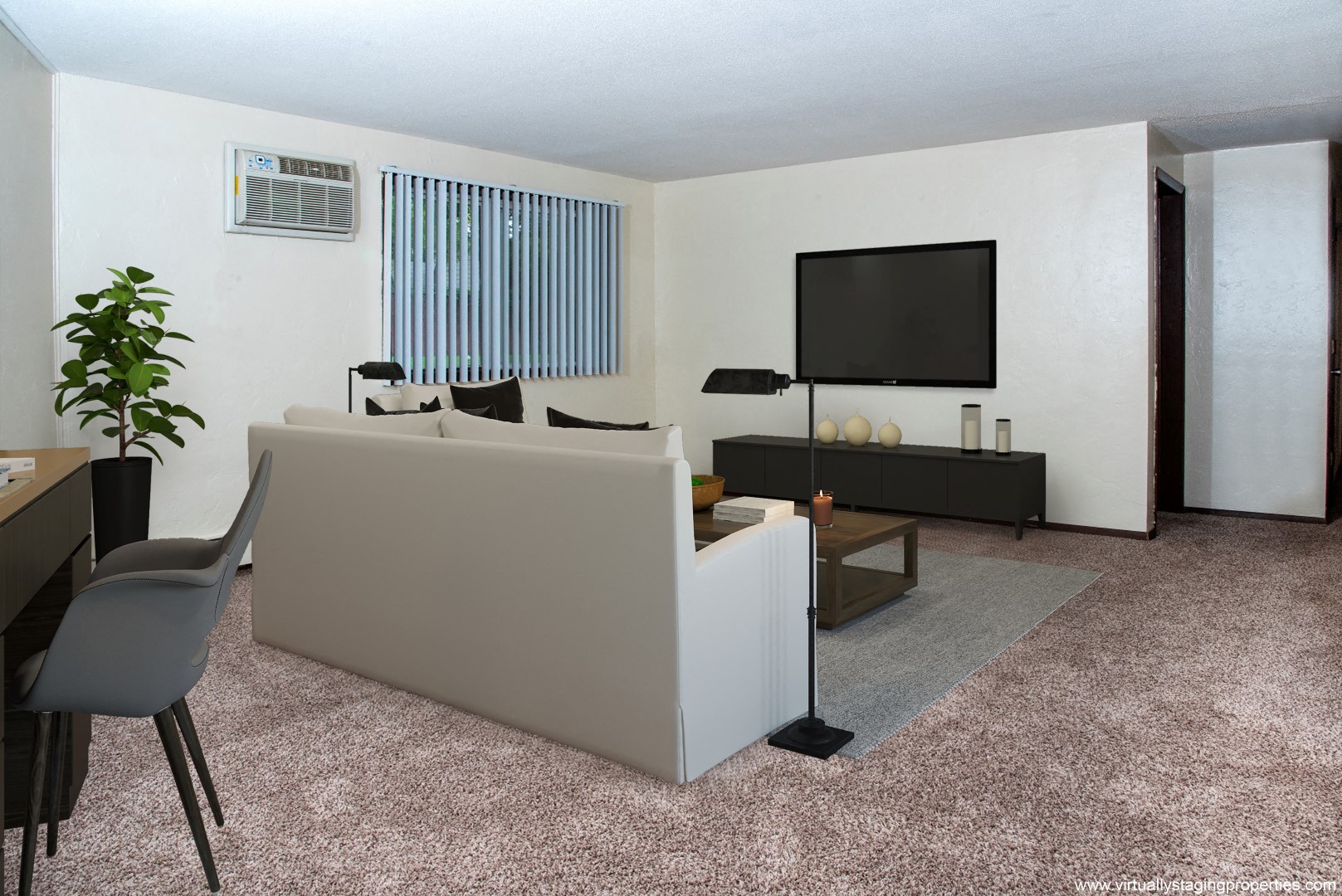 a living room with a couch and a tv