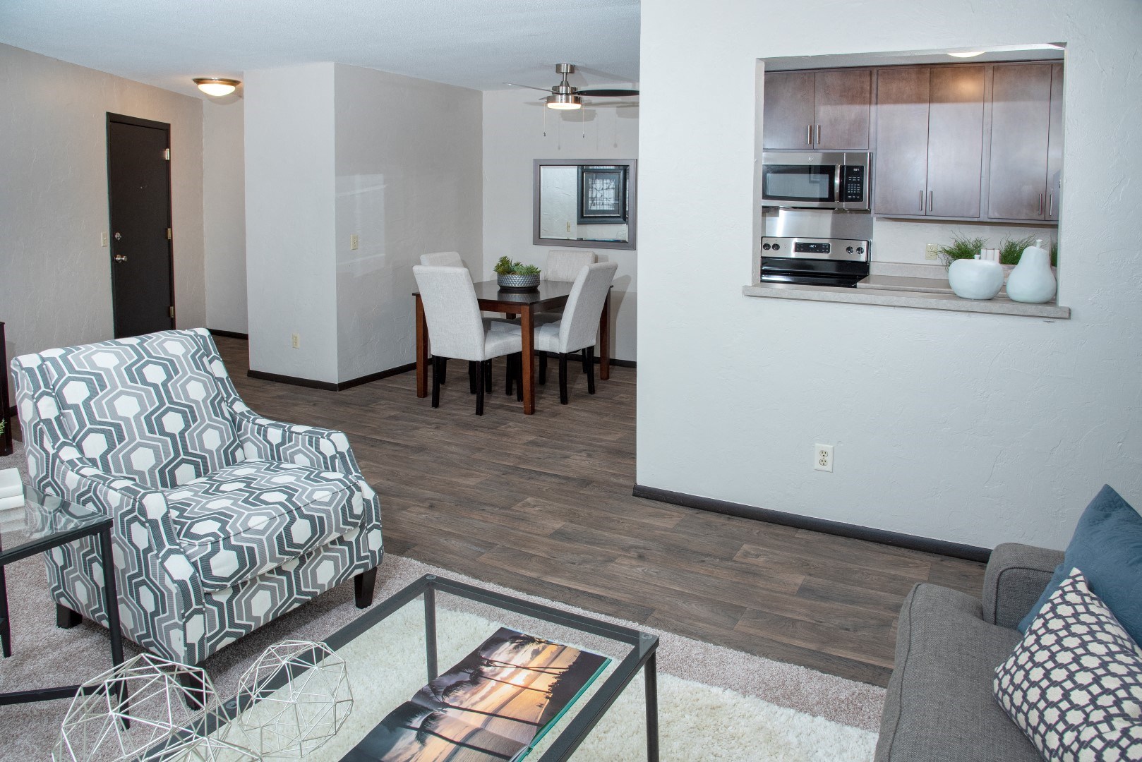 a living room and dining room with a couch and a table