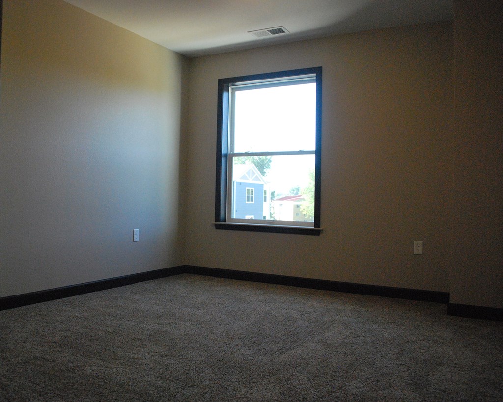 an empty room with a window in it