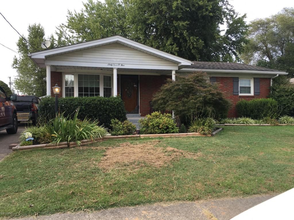 a house with a lawn in front of it