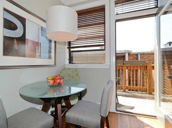 a small dining room with a table and chairs