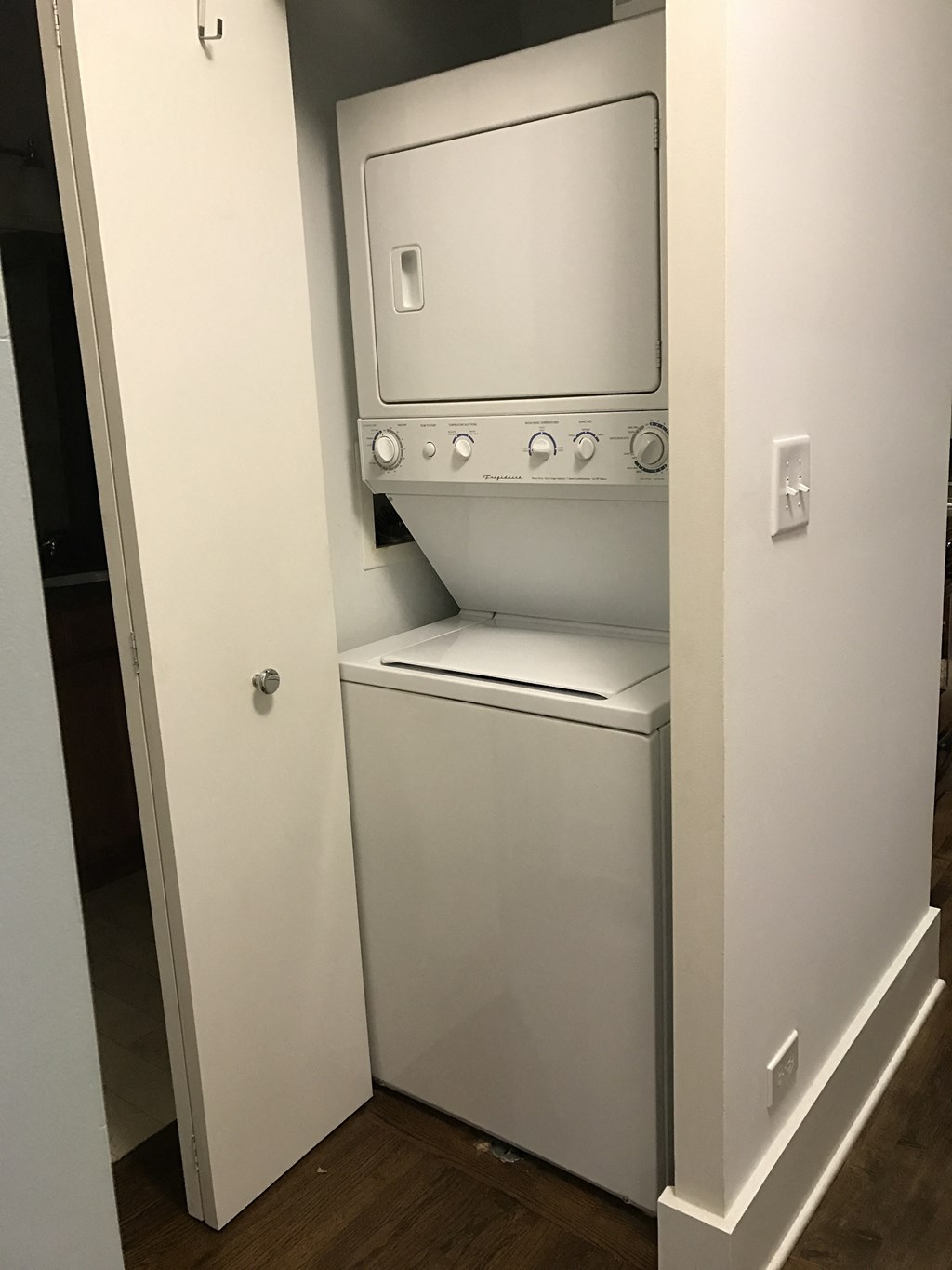 a washer and dryer in a white closet