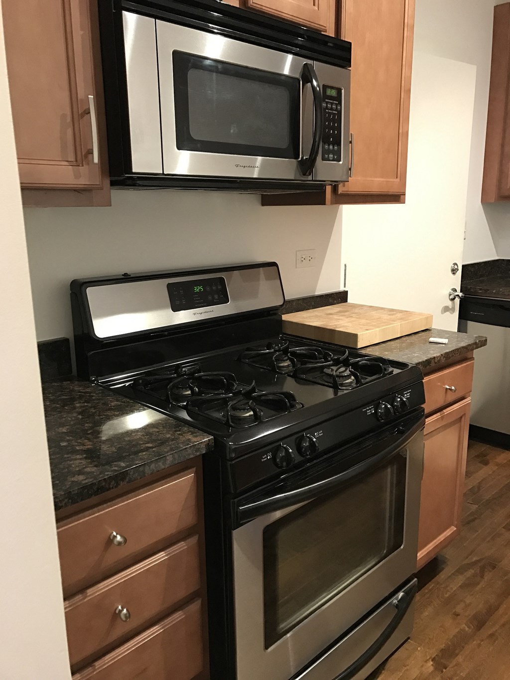 a kitchen with a stove and a microwave
