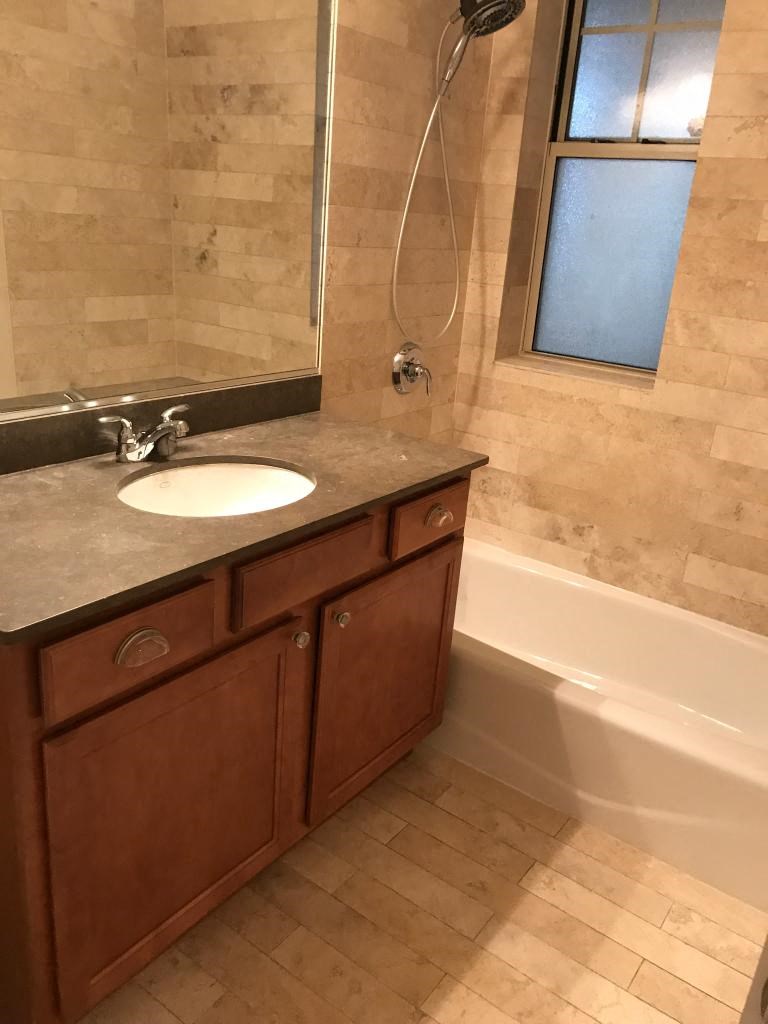 a bathroom with a sink and a bath tub