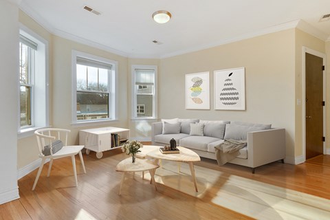 a living room with a couch and a table and a chair