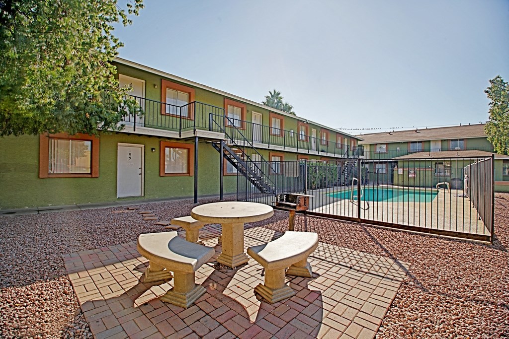 our apartments have a pool and patio area with tables