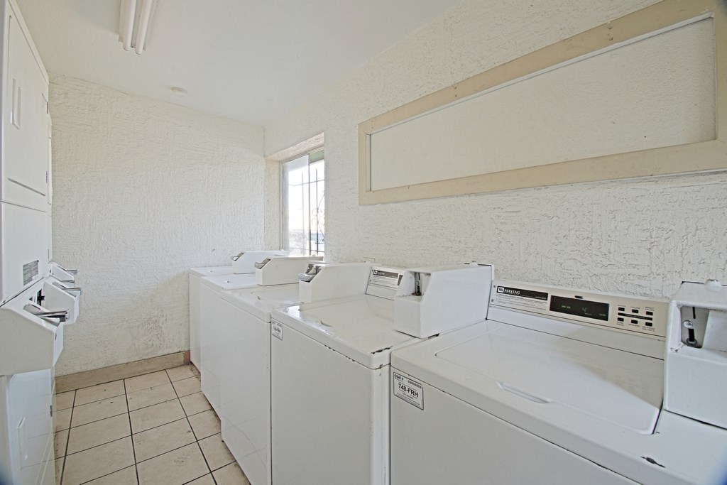 the laundry room is equipped with washes and dryers