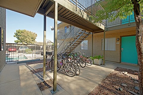 a row of bikes parked in front of a building