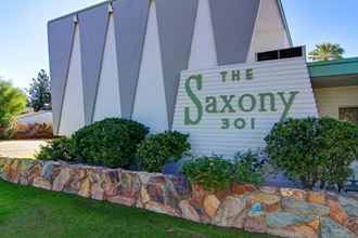 the savoy hotel sign in front of the building