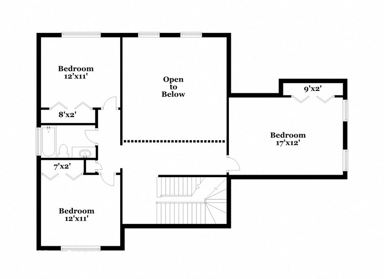 a floor plan of a house with an open floor plan with bedrooms and a kitchen
