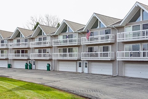 Apartment building with a flag on the second floor.