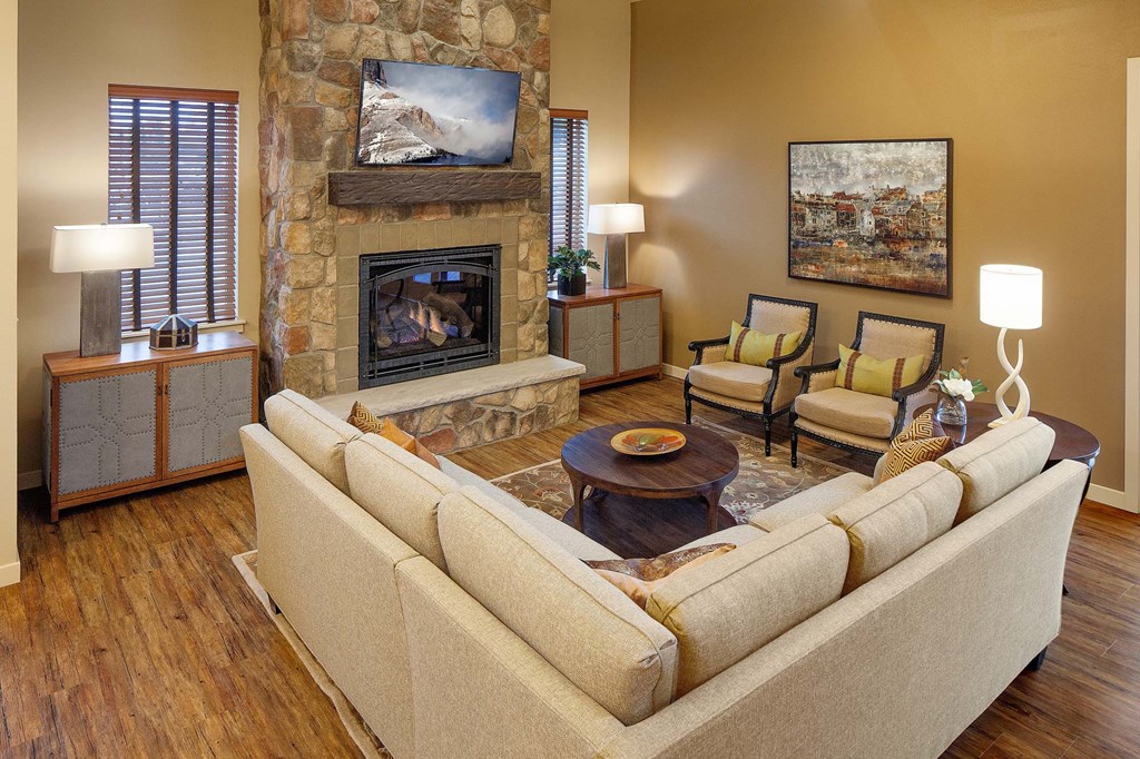 a living room with a couch and a fireplace