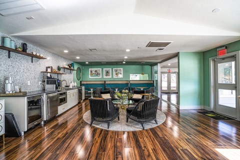 a kitchen and dining room with a table and chairs
