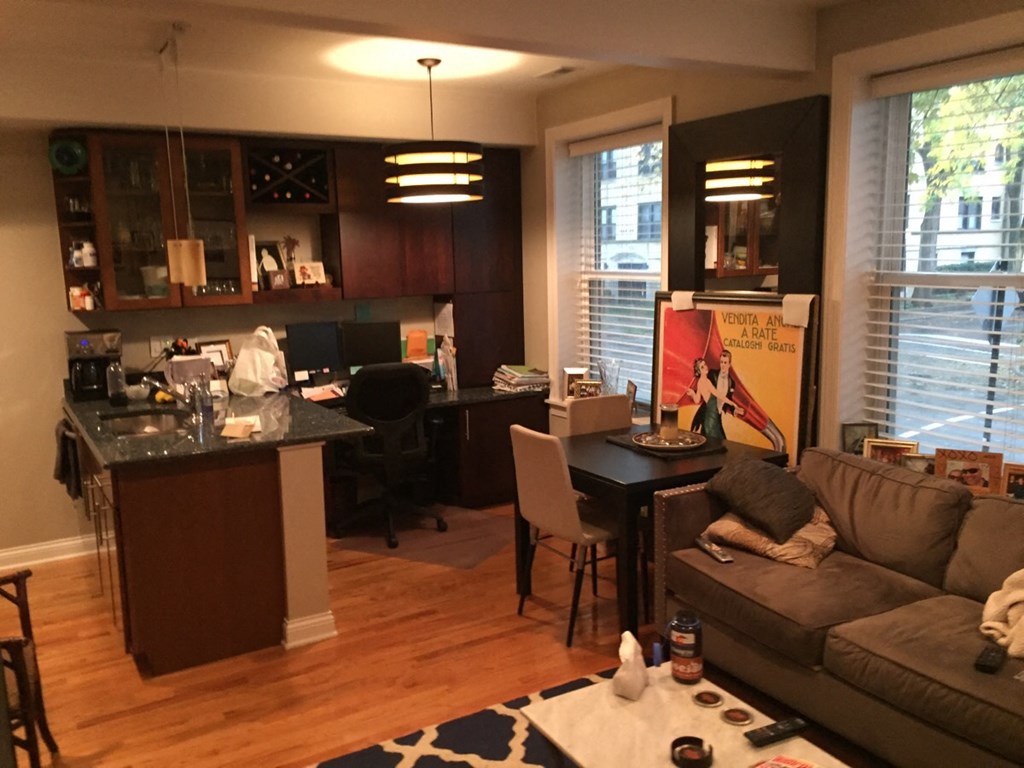 an open floor plan with a kitchen and living room