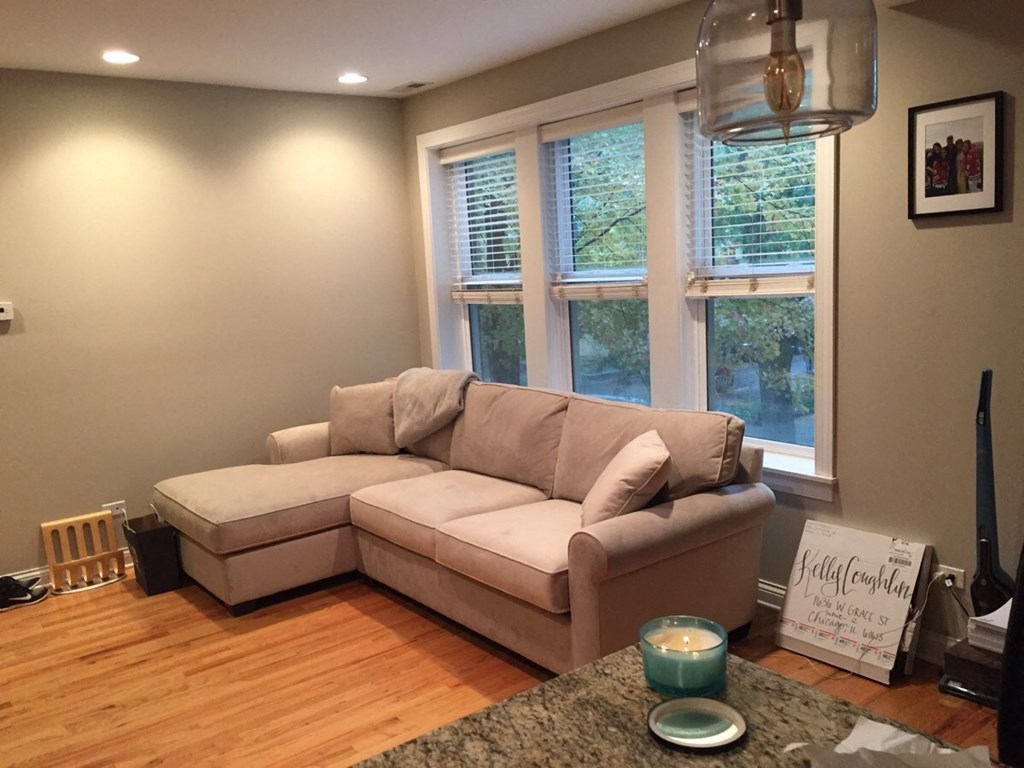 a living room with a couch and a table