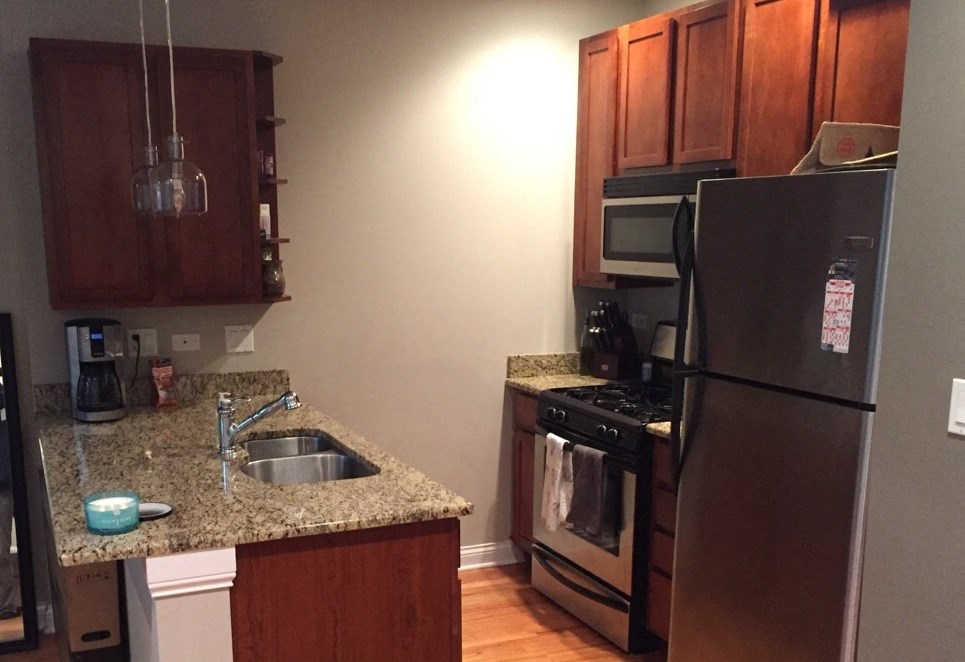 a kitchen with stainless steel appliances and a granite counter top