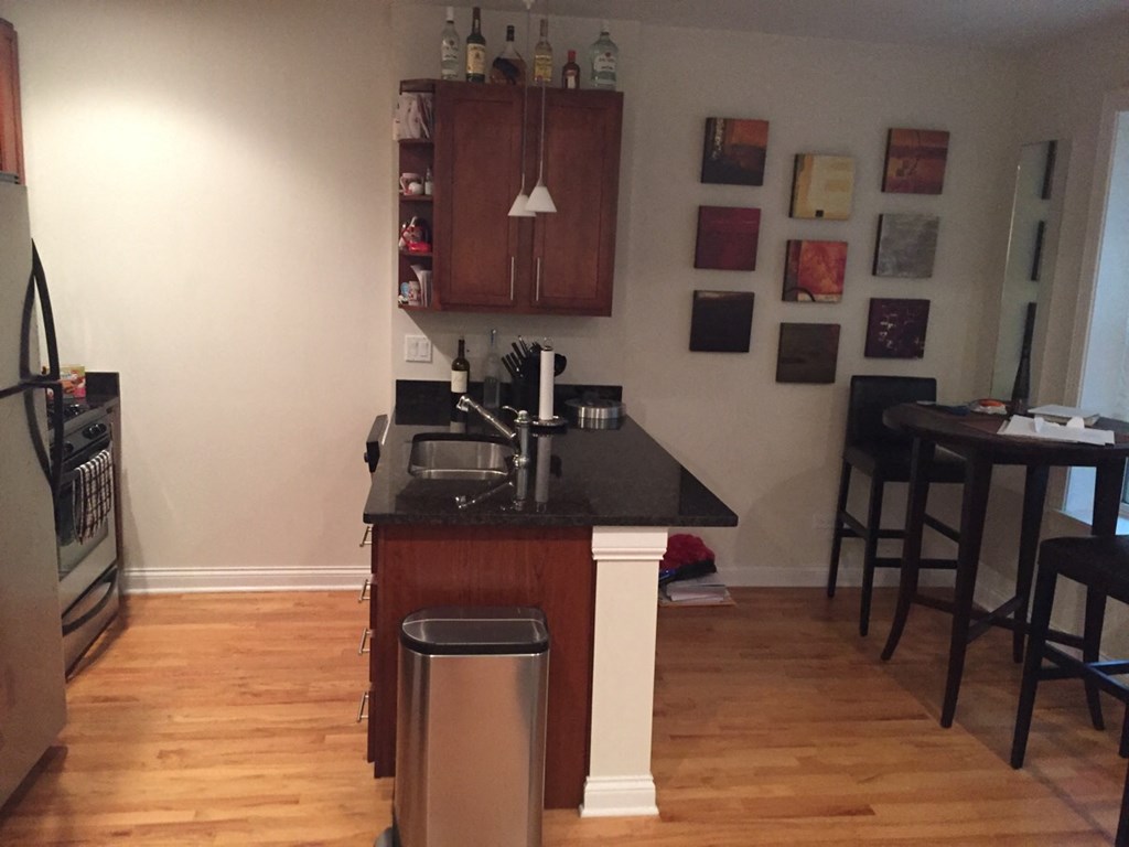 a kitchen with a counter top and a sink
