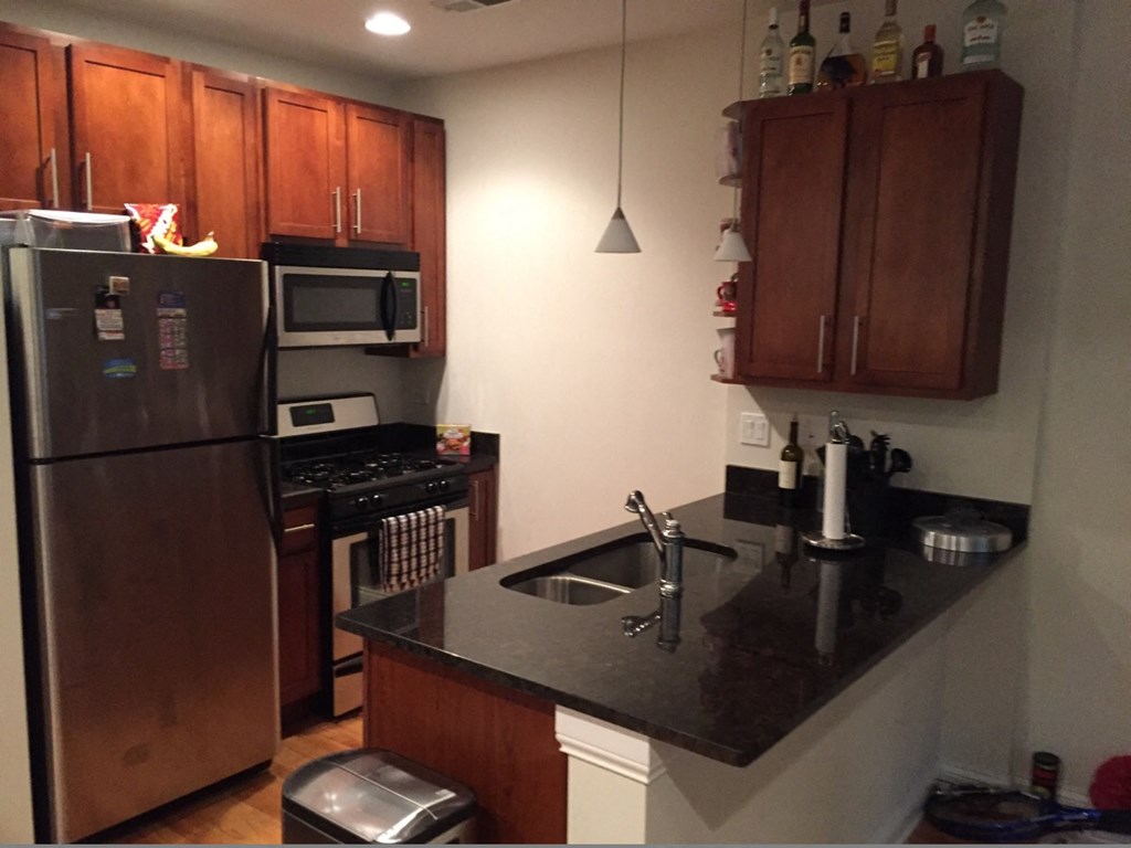 a kitchen with a sink and a refrigerator