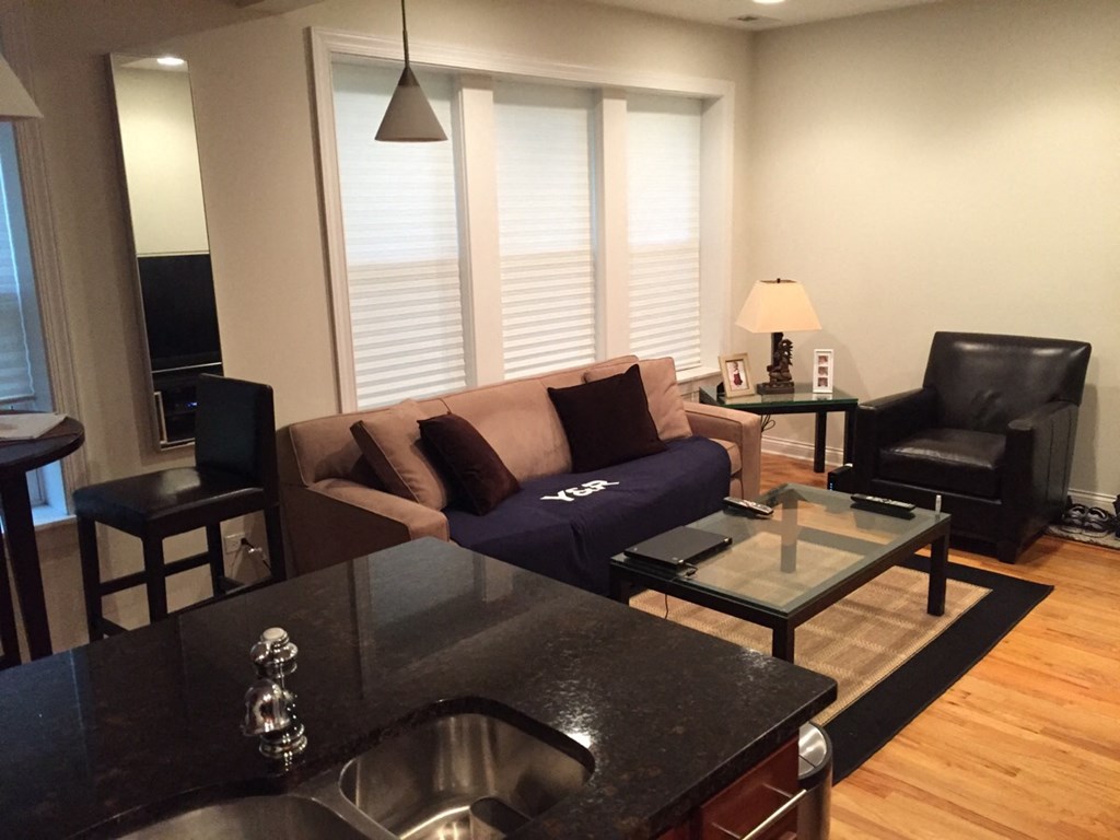 a living room with a couch and a table