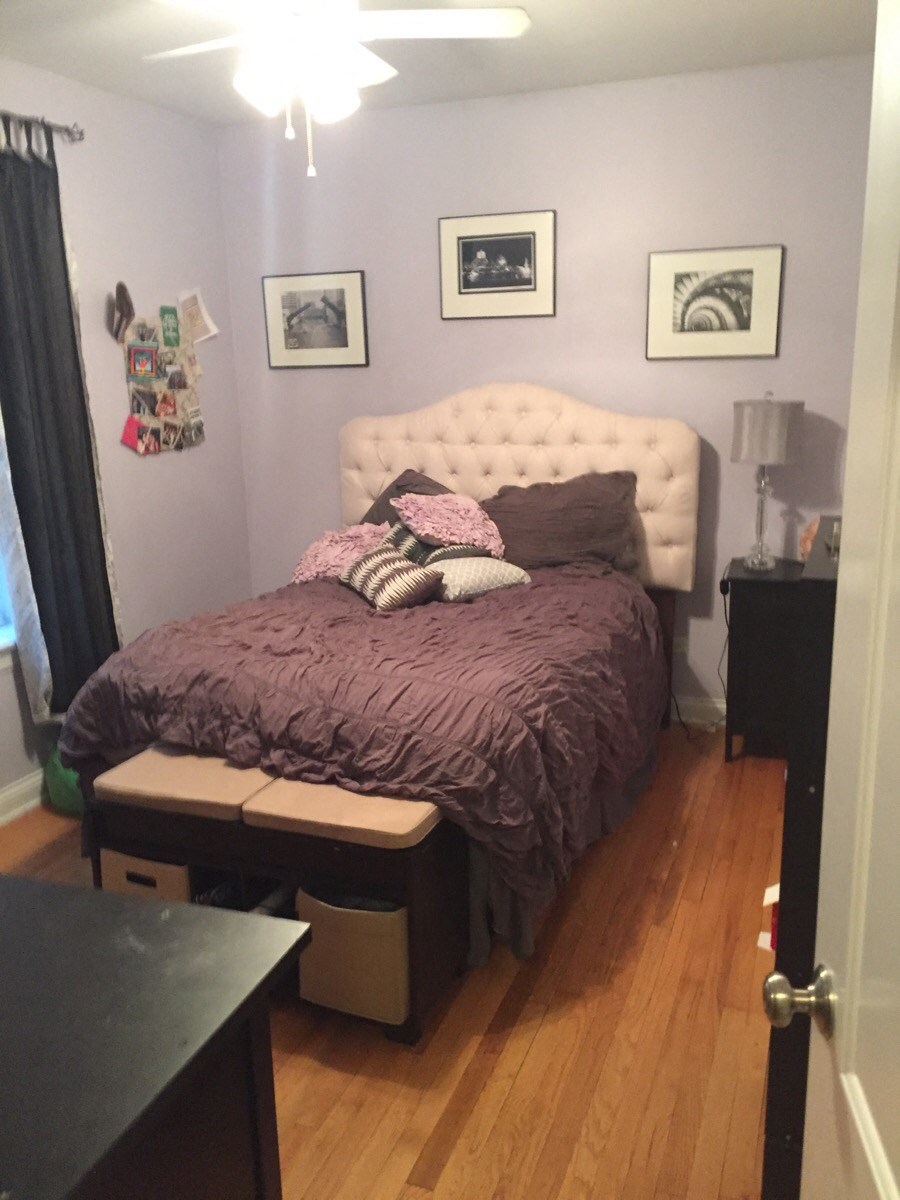 a bedroom with a bed and a couch in it