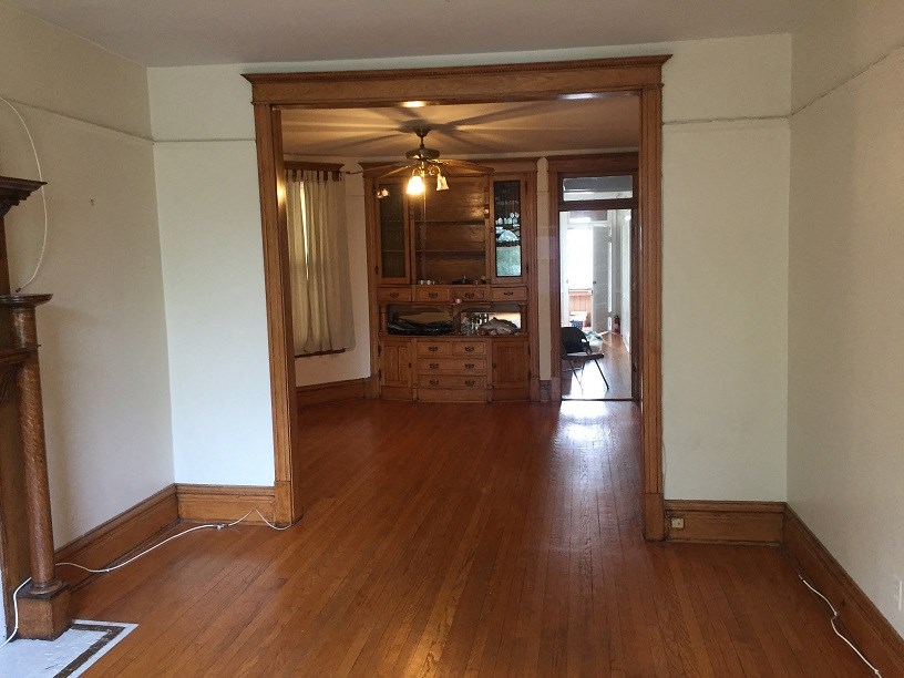 the living room looking into the dining room and kitchen