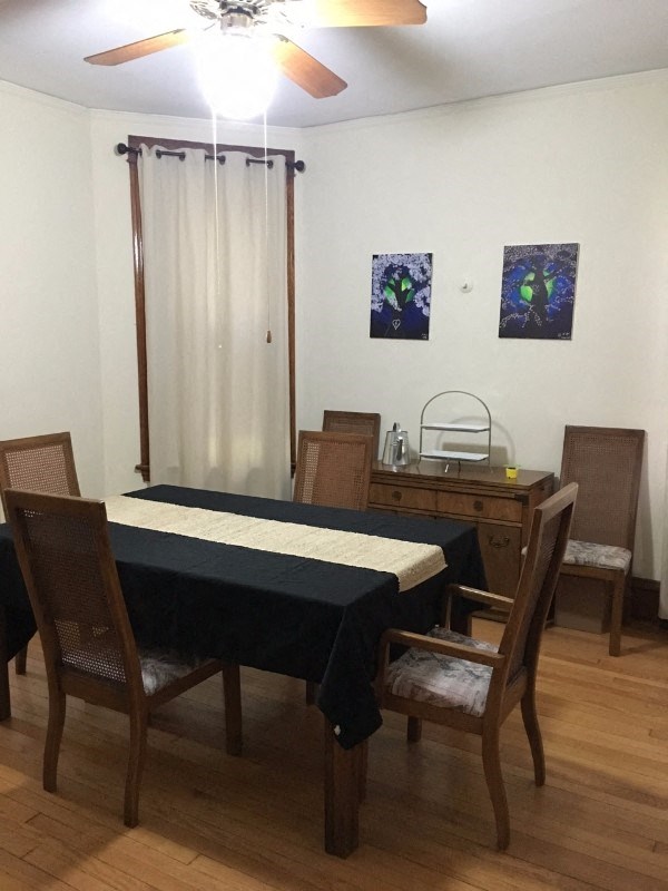 a dining room with a table and chairs