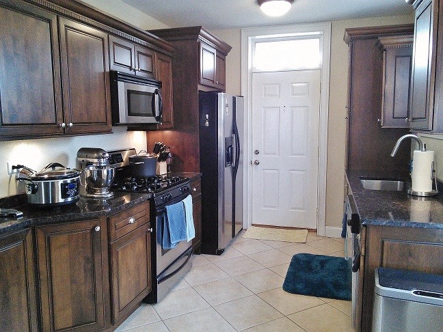 a kitchen with a stove and a refrigerator