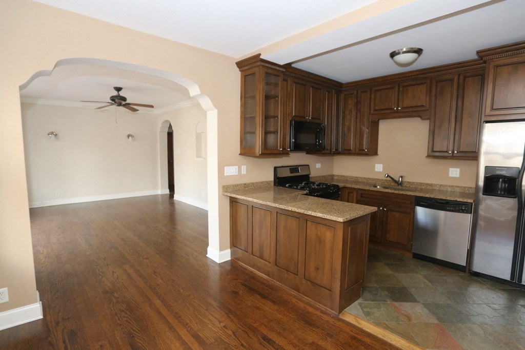 a kitchen with wooden cabinets and a counter top
