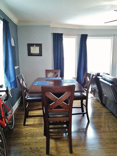 a dining room with a table and chairs