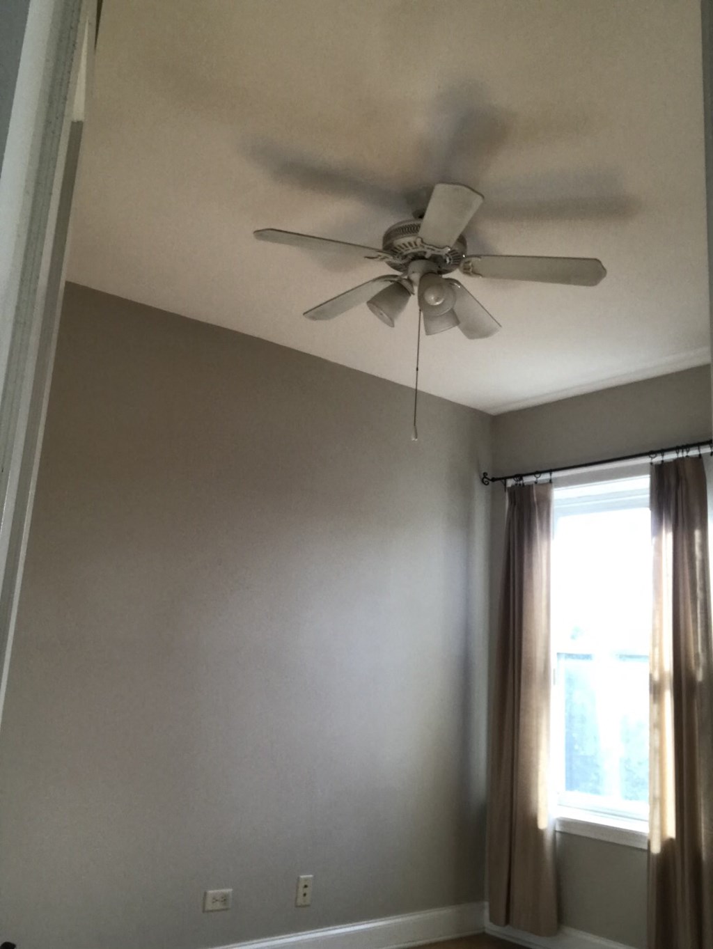 the ceiling fan in the living room has been turned off