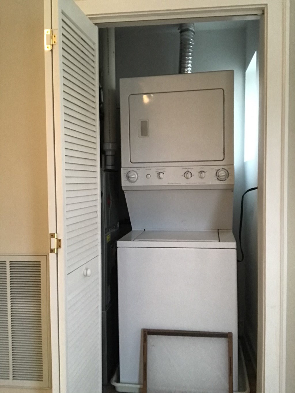 the laundry room has a washer and dryer in it