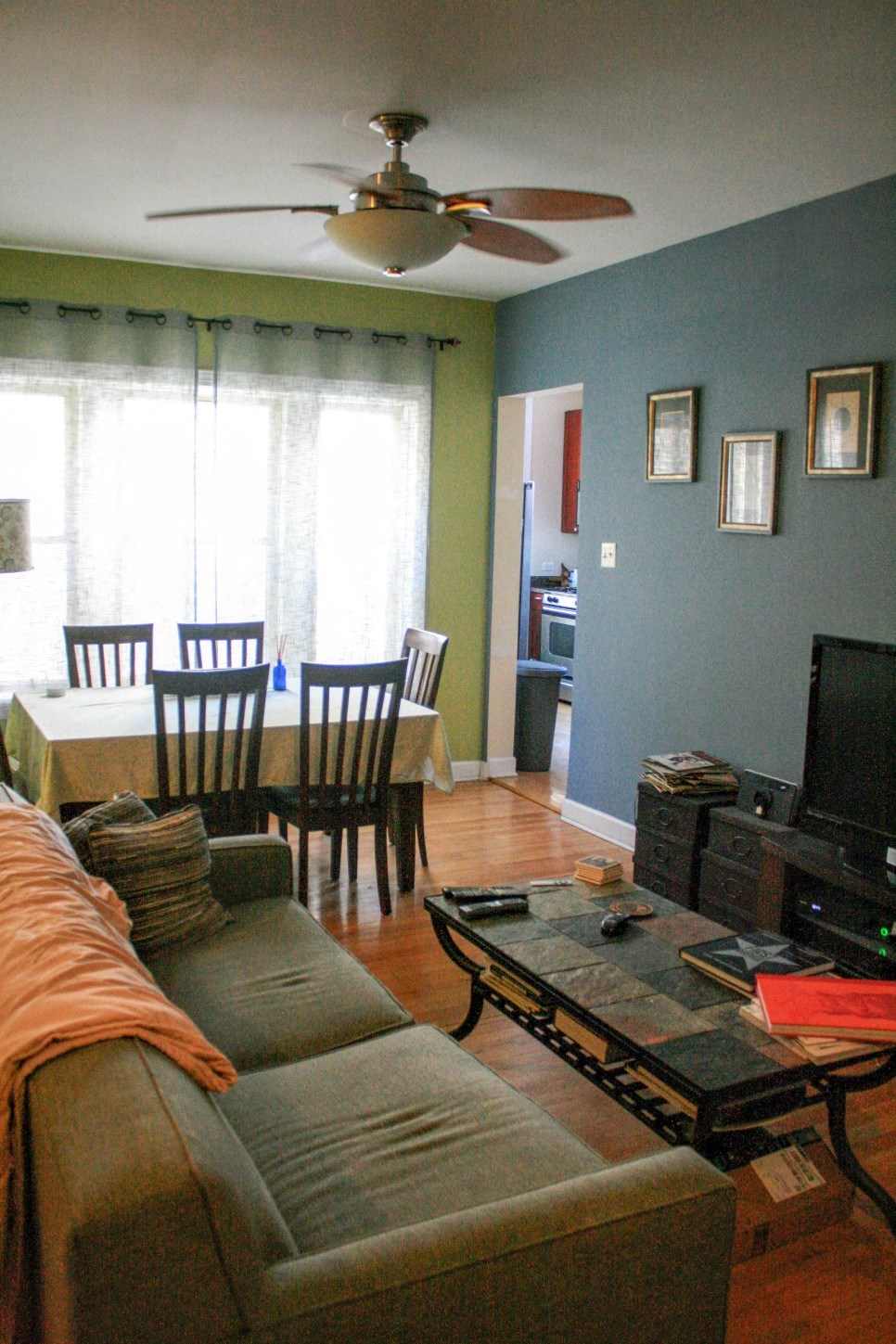a living room with a couch and a dining room table