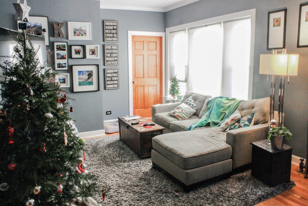a living room decorated for christmas with a christmas tree