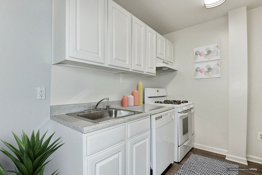 the preserve at ballantyne commons apartment kitchen with white cabinets and appliances