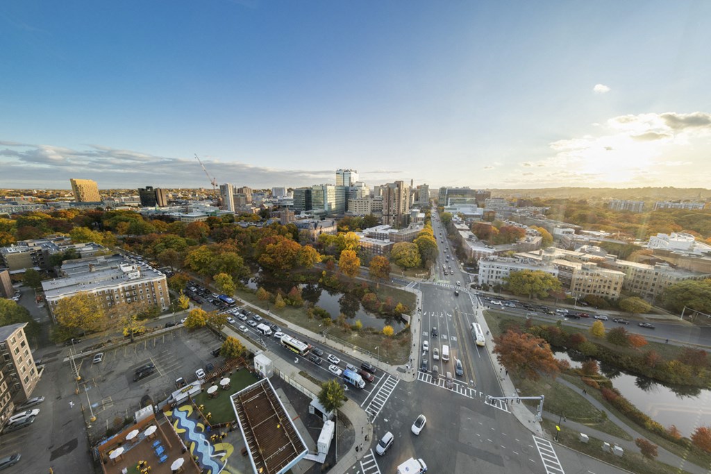 A city street with cars and buildings.