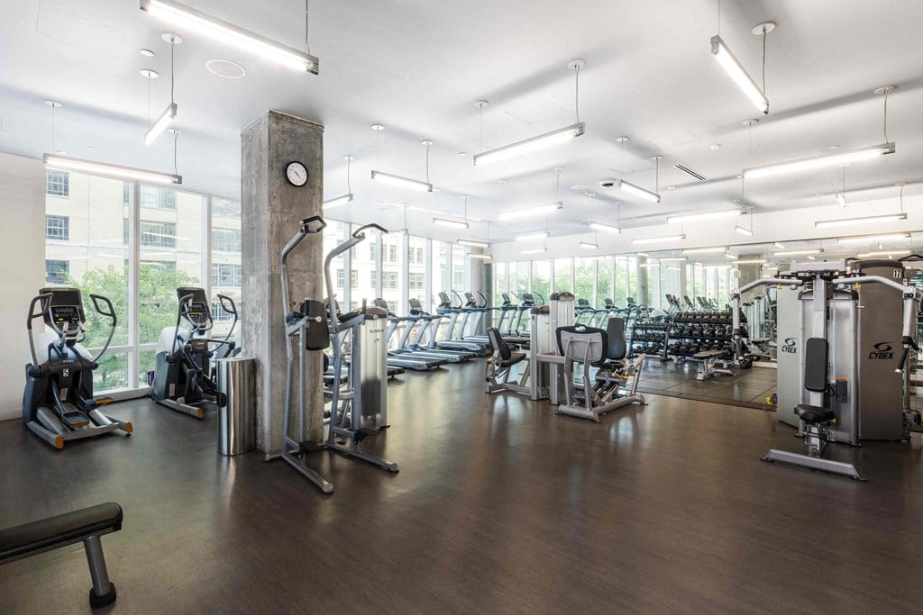 a gym with cardio machines and other exercise equipment