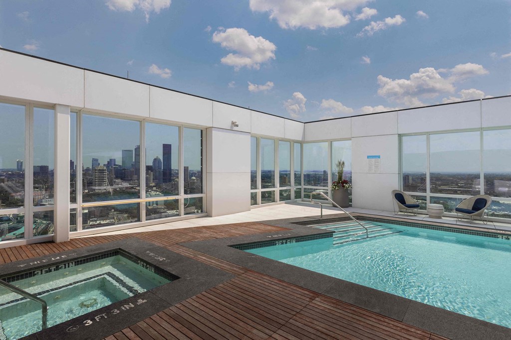 a pool and spa on the roof of a skyscraper