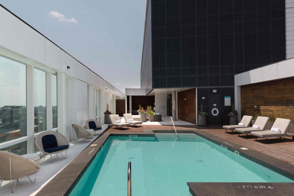 a swimming pool in the lobby of a skyscraper